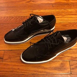 Black and white flat form shoes